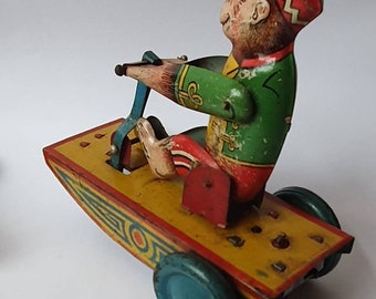 1950 Peter Pan Clockwork Tinplate Monkey Racer Giocattolo, Raro