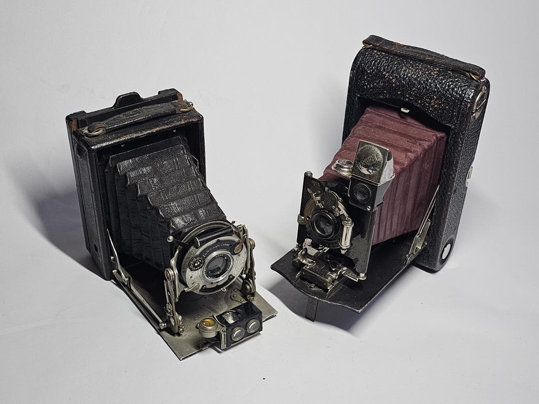 Two Antique Cameras, Butcher 