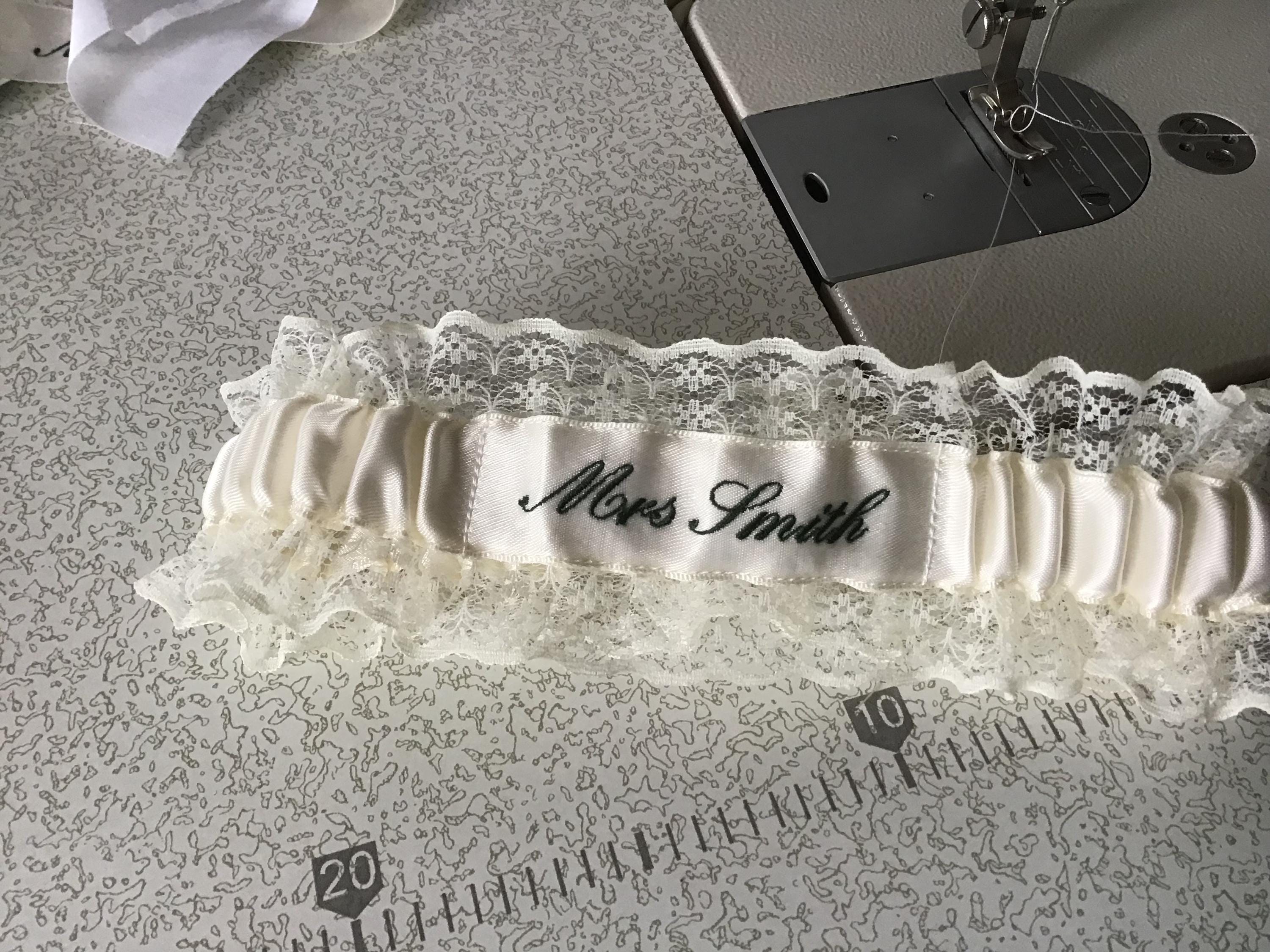 Embroidered personalised garter in white, bridal white or Ivory with a choice of embroidery thread colour.