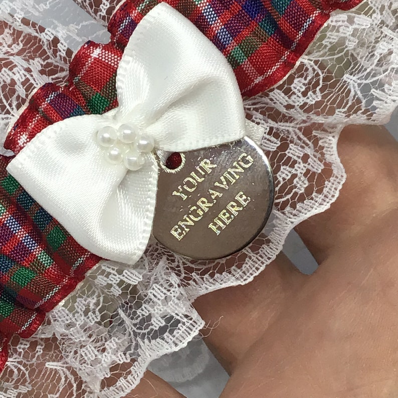 Wedding garter trimmed with lace and bow. Personalised Frazer tartan garter with engraved charm