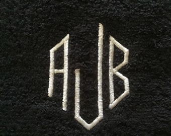 Monogramed black shaving towel, personalised with embroidered initials in a choice of colours.
