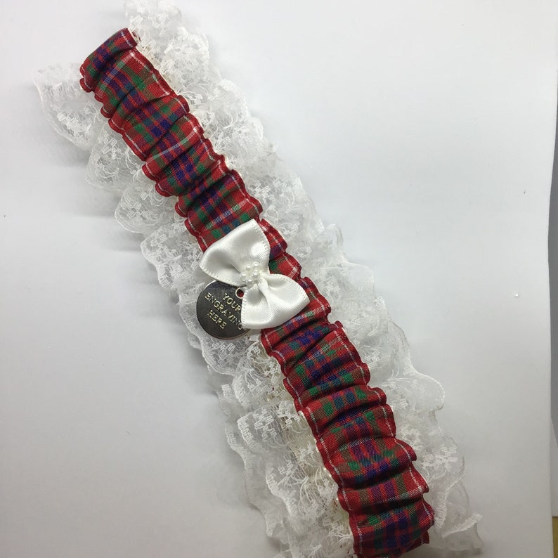 Wedding garter trimmed with lace and bow. Personalised Frazer tartan garter with engraved charm