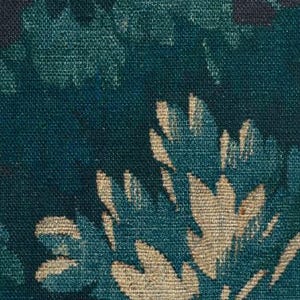 May include: A woven textile fabric featuring a dense, repeating floral pattern in shades of deep teal, dark forest green, and muted beige. The surface displays a visible, textured weave with intricate leaf and petal shapes layered across the dark background.