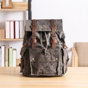 Sac à dos scolaire personnalisé en toile cirée Sac à dos de voyage Sac à dos de randonnée Sac à dos pour ordinateur portable Sac à dos en toile unisexe Sac à dos de camping