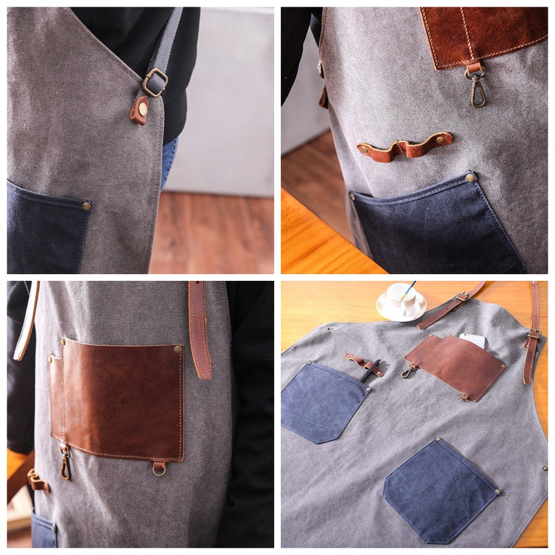 May include: Gray canvas apron with brown leather accents and pockets. Features a dark blue pocket and a brown leather pocket. Adjustable straps with metal hardware. Ideal for cooking or crafting.