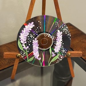 May include: A rustic wooden sign with the text "Welcome to our home" in white lettering. The sign features a distressed finish and a simple, inviting design, perfect for front door decor.