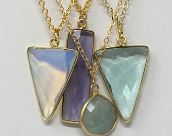 Pendant Necklaces in Amethyst and Amazonite with gold chains.