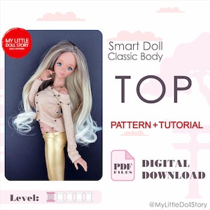 May include: A digital download pattern and tutorial for a doll top. The pattern is for a Smart Doll Classic Body. The image shows a doll wearing the finished top, which is a beige top with black bead detailing. The pattern is rated as a beginner level.