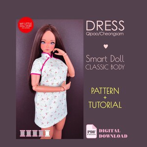 May include: A Smart Doll wearing a light blue Qipao dress with a floral pattern and pink trim. The image includes the text "DRESS Qipao/Cheongsam", "Smart Doll CLASSIC BODY", "PATTERN + TUTORIAL", and "DIGITAL DOWNLOAD".
