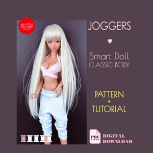 May include: A Smart Doll with long white hair, wearing a light pink top and light blue joggers. The image includes text that reads "JOGGERS", "Smart Doll CLASSIC BODY", "PATTERN + TUTORIAL", and "DIGITAL DOWNLOAD". The doll is posed against a dark purple background.