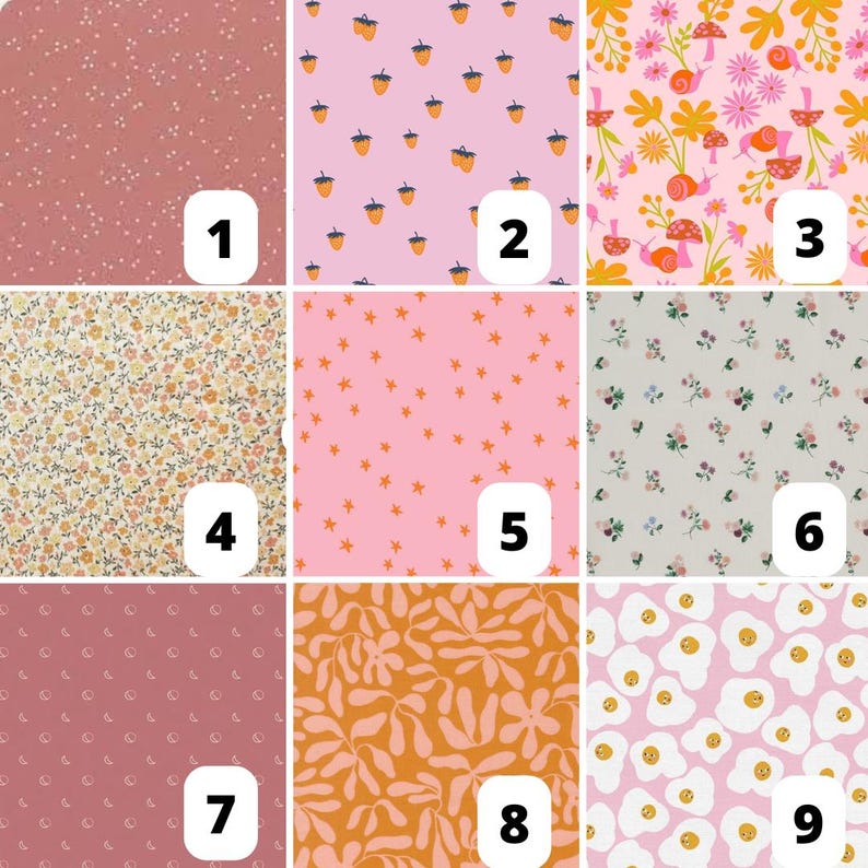 May include: Nine fabric swatches with various patterns. The patterns include small white dots on a dusty rose background, acorns on pink, floral and snail design, floral pattern, orange stars on pink, small flowers, small crescent moons, orange floral design, and fried eggs.