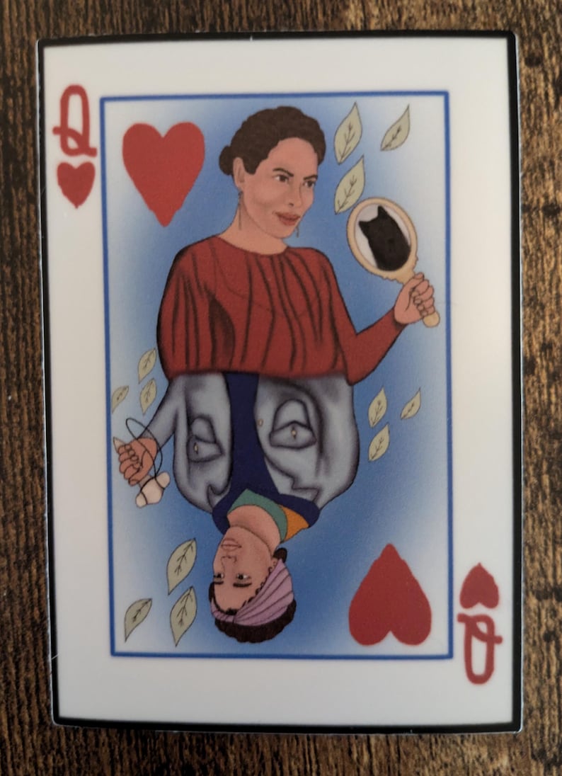 May include: A Queen of Hearts playing card with a woman's face on it. The woman is wearing a red shirt and a blue jacket. She is holding a mirror with a black cat in it. There are leaves falling around her.