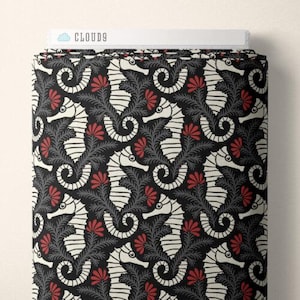 May include: Black and white fabric with a repeating pattern of stylized seahorses and red flowers. The fabric has a subtle texture.