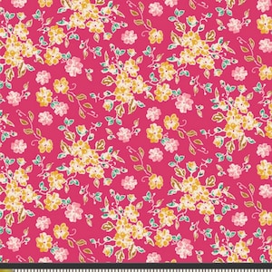 May include: A pink fabric with a floral pattern. The flowers are yellow and white with green leaves. The fabric is measured with a ruler in inches.