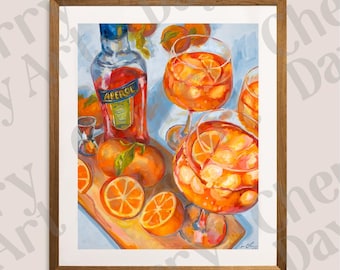 May include: A framed art print featuring a still life of an Aperol bottle, oranges, and cocktails. The painting has a vibrant color palette of orange, red, and blue. The image includes a bottle of Aperol, cocktail glasses, and orange slices.