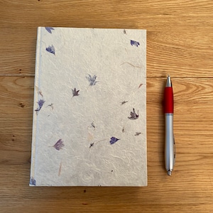 Notebook made from lokta paper with  blue and pink petals, stationery gift made of handmade paper, plain pages, fair trade. Ideal gift .