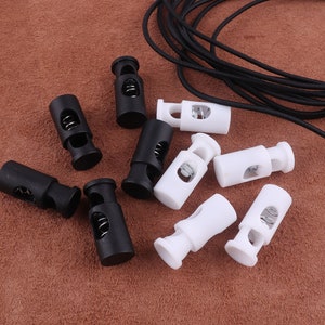Blocco cavo 128mm,Cylindrical bianco nero Plastica Cord Stopper Corda Fine Toggle Clip Clip Buckle,Shoelace Sportswear Abbigliamento Maschera regolazione del cavo
