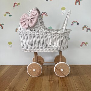 Wicker pram with bow, tall dolls pram, bow and bedding included. White