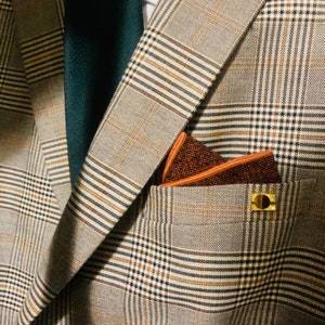 A set of five mens wool pocket square handkerchiefs in rust, burnt orange, brown, deep red and moss green. The set comes with free gift wrapping and is an ideal mens gift, groomsmen gift or to be used as wedding attire.