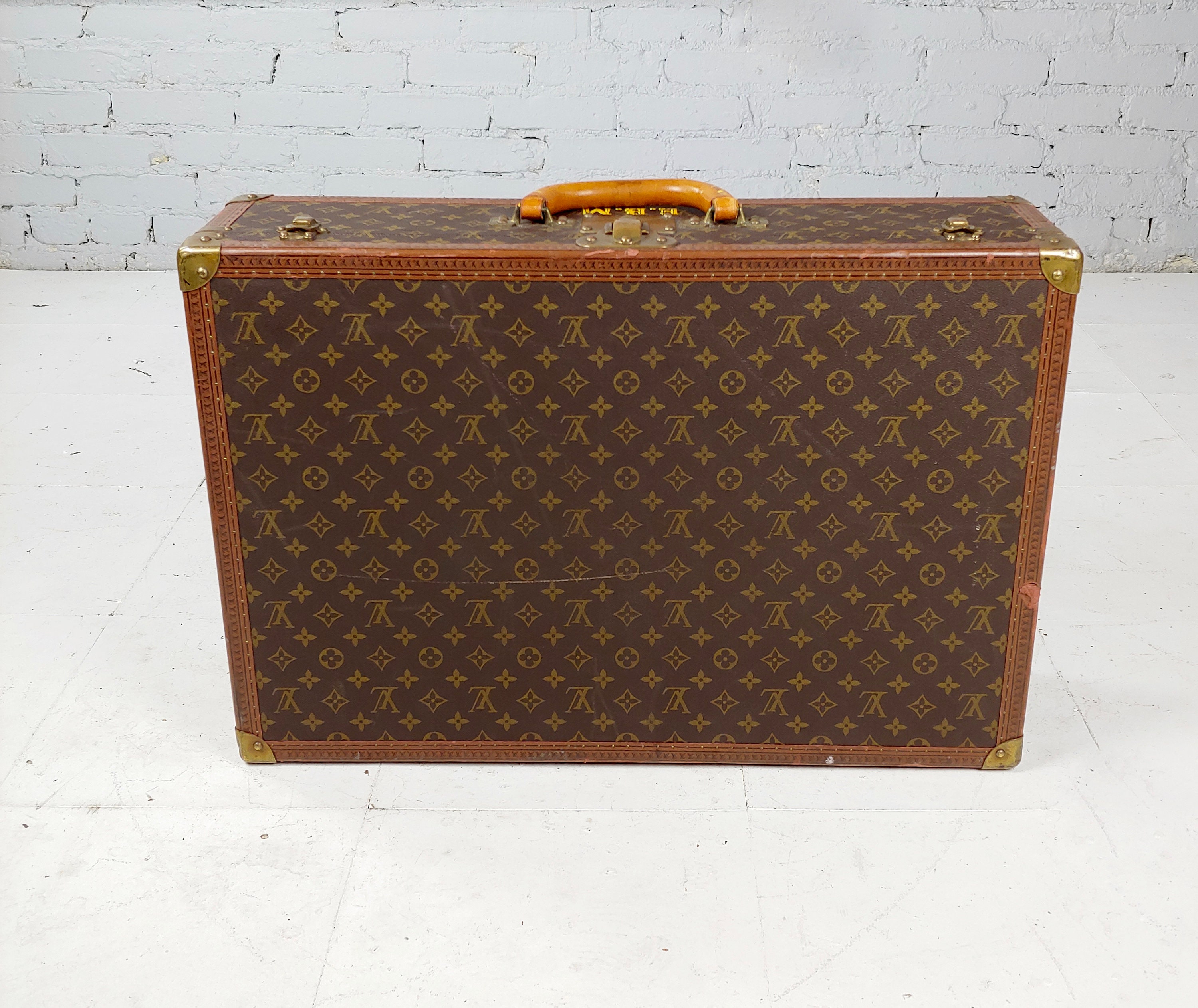 Lot - A vintage Louis Vuitton Bisten 55 Monogram suitcase