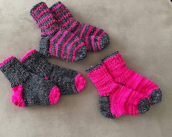 Hand-knitted exclusive baby socks in a set of 3.