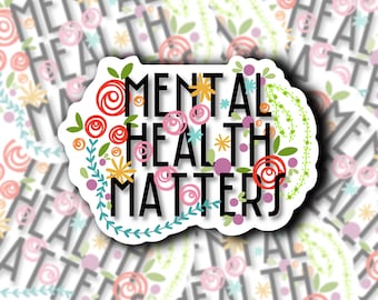 May include: A white sticker with a floral border and the text "Mental Health Matters" in black lettering. The flowers are in shades of pink, red, yellow, and green.