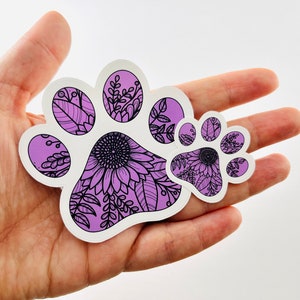 Empreinte de patte de chien chiot. Impression de tournesol violet. Vinyle découpé, autocollant pour pare-chocs, autocollant pour téléphone ou ordinateur portable, autocollant pour bouteille d'eau
