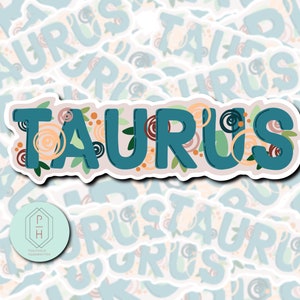 May include: A teal blue sticker with the word "TAURUS" in a stylised font with floral accents in shades of peach, brown, and green.