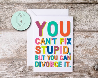 May include: A white card with colorful text that reads "YOU CAN'T FIX STUPID, BUT YOU CAN DIVORCE IT."
