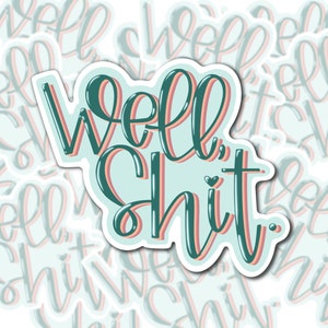 May include: A sticker with the text "Well, Shit." in a green, pink, and blue color scheme. The sticker has a white border and a heart shape in the middle of the text.