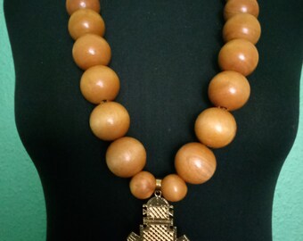 Ethiopan cross necklance with Large wooden beads.
