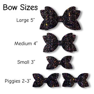 May include: Four sizes of black glitter hair bows. The bows are arranged from largest to smallest. The sizes are labeled as Large 5", Medium 4", Small 3", and Piggies 2-3".