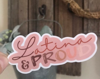 May include: A pink and brown sticker with the text "Latina & Proud" in a cursive font.