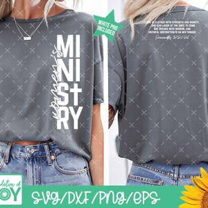 May include: A grey t-shirt with the word "Ministry" in large white letters. The word "women's" is printed vertically on the left side. The back of the shirt has a Bible verse printed in white. The shirt is paired with blue jeans.