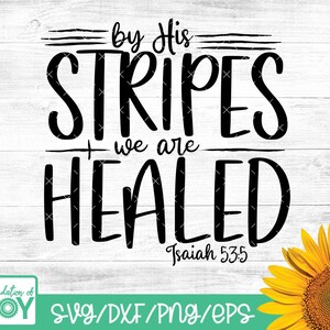 May include: Black and white graphic text on a wood background with a sunflower in the corner. The text reads "by His Stripes we are Healed" with the scripture reference "Isaiah 53:5".