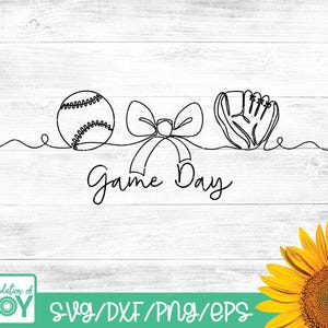 May include: Black line art design featuring a baseball, a bow, and a baseball glove. The words "Game Day" are written in cursive below the illustrations. The background is a white wood grain pattern.