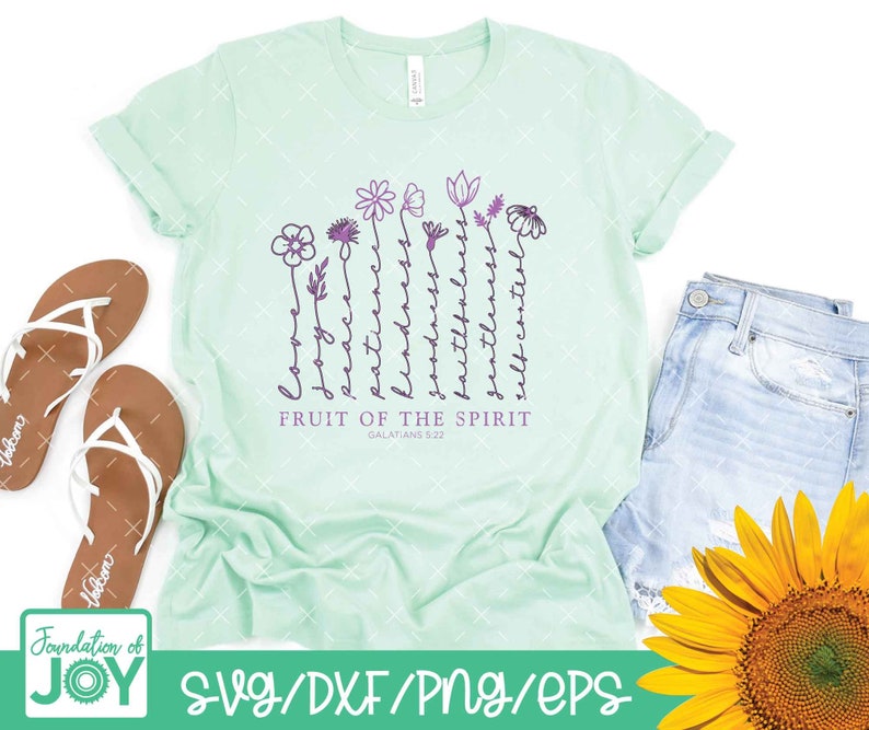 May include: A light green t-shirt with a design of flowers and the words "Fruit of the Spirit" with the scripture reference "Galatians 5:22".