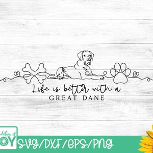 May include: A black and white line drawing on a white wooden background. The drawing features a Great Dane dog, a bone, and a paw print. The text reads "Life is better with a Great Dane".