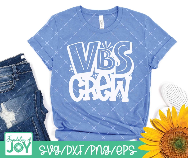 May include: A light blue t-shirt with the text "VBS Crew" in white. The text is in a playful, hand-drawn style.
