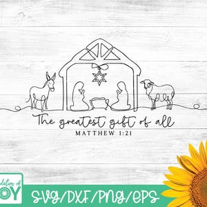May include: A black and white line drawing of a nativity scene with the text "The greatest gift of all" and "Matthew 1:21". The image includes a stable, star, donkey, sheep, and figures. The bottom right corner features a sunflower.