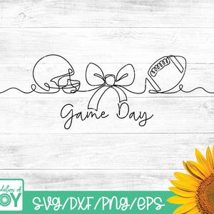 May include: Black line art design featuring a football helmet, a bow, and a football, with the words "Game Day" in cursive. The design is on a white wood-grain background. The bottom of the image has the text "SVG/DXF/PNG/EPS".