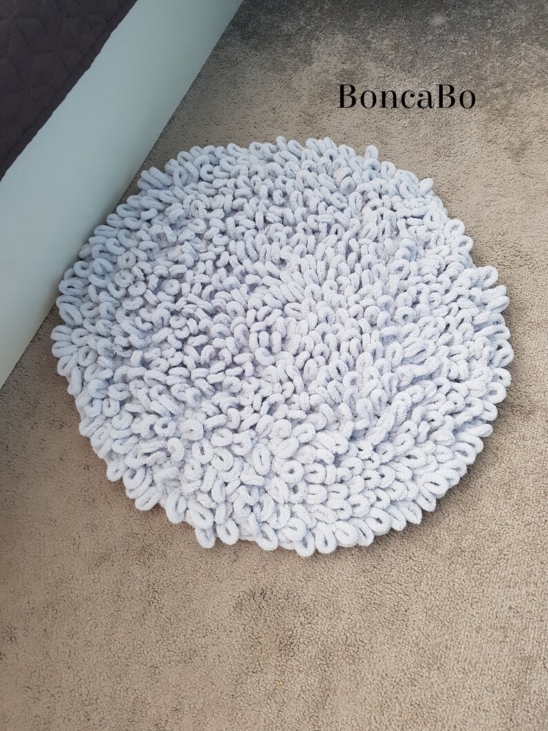 Small round bath rug for cute apartment decor. Crochet