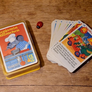 Könnte beinhalten: Ein Vintage-Spiel Quartett mit Benjamin Blümchen, einem Comic-Elefanten. Das Spiel enthält Karten mit Illustrationen von Benjamin in verschiedenen Szenarien, wie z. B. als Koch und Feuerwehrmann. Die Karten haben deutschen Text.