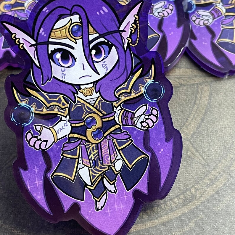 May include: A purple and gold anime character with long purple hair and a crown. The character is wearing a dark purple robe with gold accents and is holding a glowing orb in each hand. The background is a purple and white gradient.