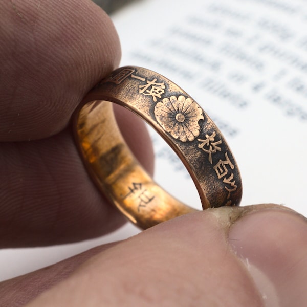 1876 Japanese sen ring made from a copper coin in the UK. Handmade coin ring featuring floral wreaths, bows and chrysanthemum.