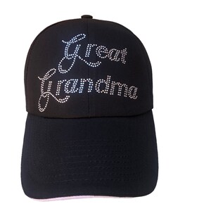 May include: Black baseball cap with white rhinestones spelling out "Great Grandma".