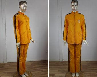 adidas Survêtement 70s Orange Jaune Veste de pluie Léger Coupe-vent à capuche vintage Manteau Nylon Sports Rayé années 1970 Taille L/M