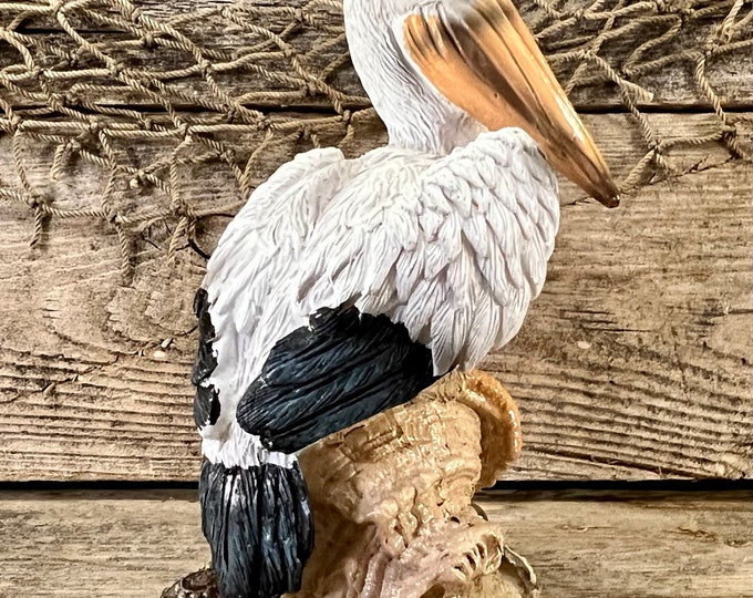 Hand-Painted Resin Coastal Pelican Perched On Conch Shell Figurine