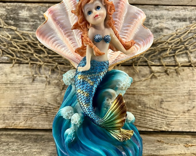 Beautiful Auburn Haired Mermaid with Shimmering Metallic Blue Tail Riding Cresting Ocean Wave Resin Statue