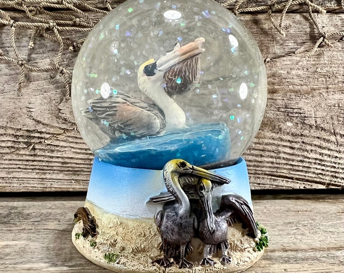 Brown Pelican Water Eating Fish Hand-Painted Molded Resin and Glass Water Globe